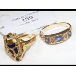 A 9ct gold ring set with sapphires and diamonds to