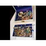 A jewellery box containing assorted costume jewell