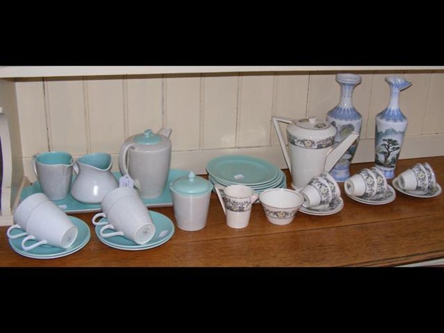 A medley of two tone Poole Pottery tea ware and Ar