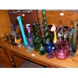 An assortment of glass vases, bottles and jugs, in