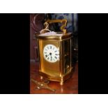 A brass cased carriage clock - 14cms high