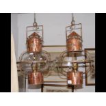 Two Hugh Douglas copper and brass ships lamps