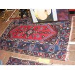 A Turkish carpet with red ground geometric border