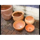 Five terracotta pots of various sizes