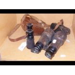 A pair of vintage binoculars together with two pai
