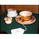 A miniature Royal Worcester hand painted cup and s
