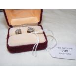 A pair of white gold diamond cluster earrings