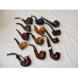 A collection of vintage tobacco smoking pipes