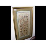 A Chinese silk depicting 100 boys - framed and gla