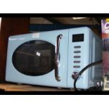 A 800watt microwave oven in powder blue