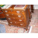 A small proportioned antique four drawer chest wit