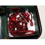 Four strings of cherry amber Bakelite beads