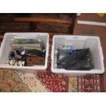 Two boxes of model train accessories