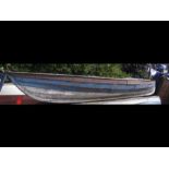A vintage blue two man canoe, length 4 metres 20 -