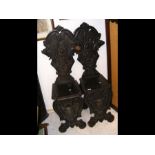 A pair of carved antique hall chairs