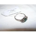 A lady's emerald and diamond ring in 18ct white go