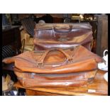 A Gladstone style leather bag together with one ot