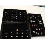 Three display cases of dress rings