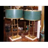 A pair of decorative brass table lamps