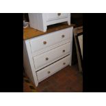 A pine chest of three painted drawers - width 85cm