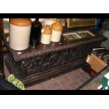 A carved oak coffer - 156cm long