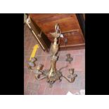 A gilt brass five branch chandelier with acanthus