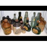 A collection of various stoneware and glass bottle