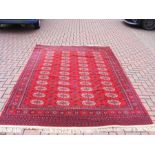 A Middle Eastern style carpet with red ground - 9f