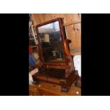 A Victorian mahogany toilet mirror with two drawer