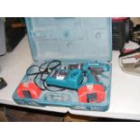 A Makita cordless drill with charger