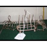 A silver toast rack, together with two others