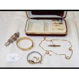 A ladies gold cased wrist watch, earrings etc.