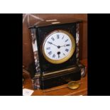 A Victorian black slate marble clock with single t