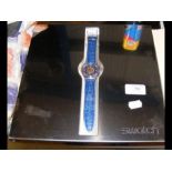 A Limited Edition Swatch Platinum watch in present