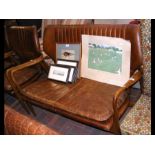 A retro style Laura Ashley two seater tan distressed leather
