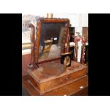 An antique toilet mirror with single drawer to the