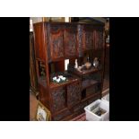 An antique carved hardwood oriental display cabine