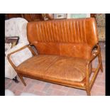 A retro style Laura Ashley two seater tan distressed leather
