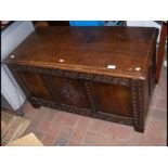 A panelled oak coffer - 95cm