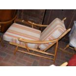 A retro light Ercol easy chair