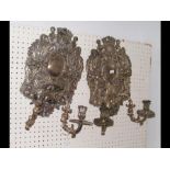 A pair of decorative silver plated wall sconces -