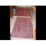 A Middle Eastern red ground rug with centre medall