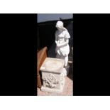 A 72cm high garden ornament with plinth