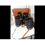 A pair of Boots 10 x 50 binoculars in case