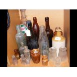 Various vintage bottles, including Castrol