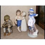 A Lladro figure of boy with puppy together with to