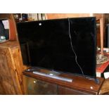 A JVC 40" flat screen TV - complete with remote