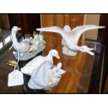 Three Lladro figures, including a goose taking off