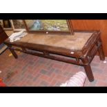 A large old Chinese bench with basket weave top -