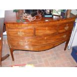 A 19th century bow fronted mahogany chest of four
